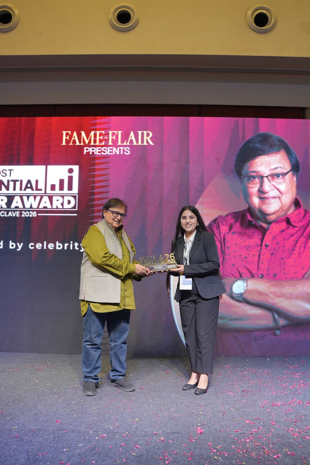 Sachi Tamrakar receiving an award at an event